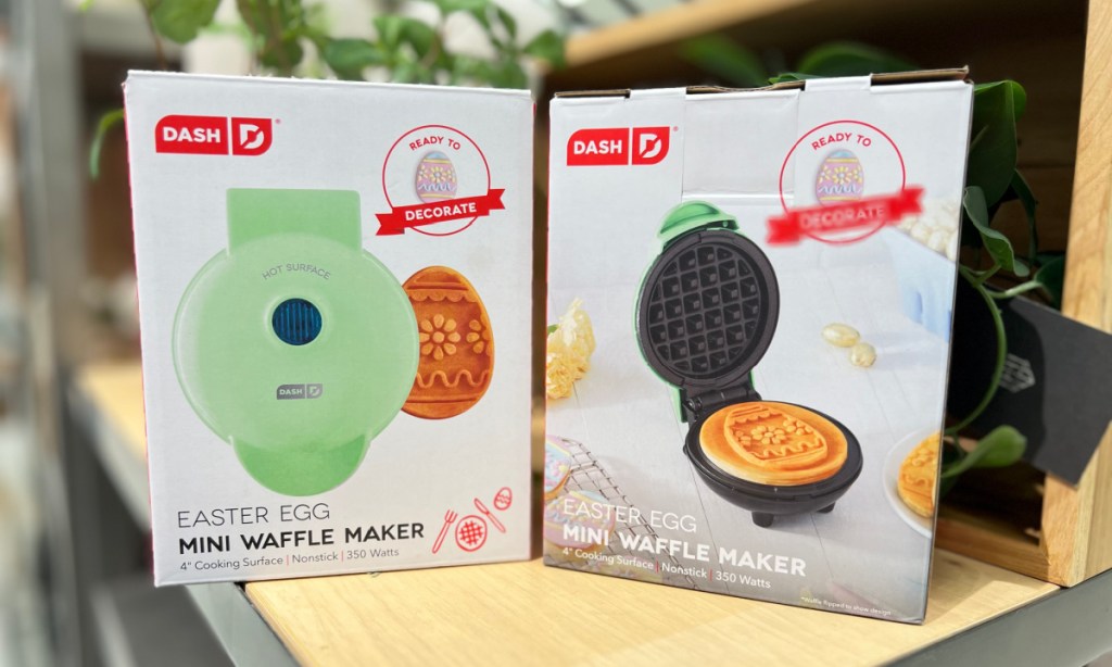 A dash waffle maker in the shape of an Easter egg displayed on table
