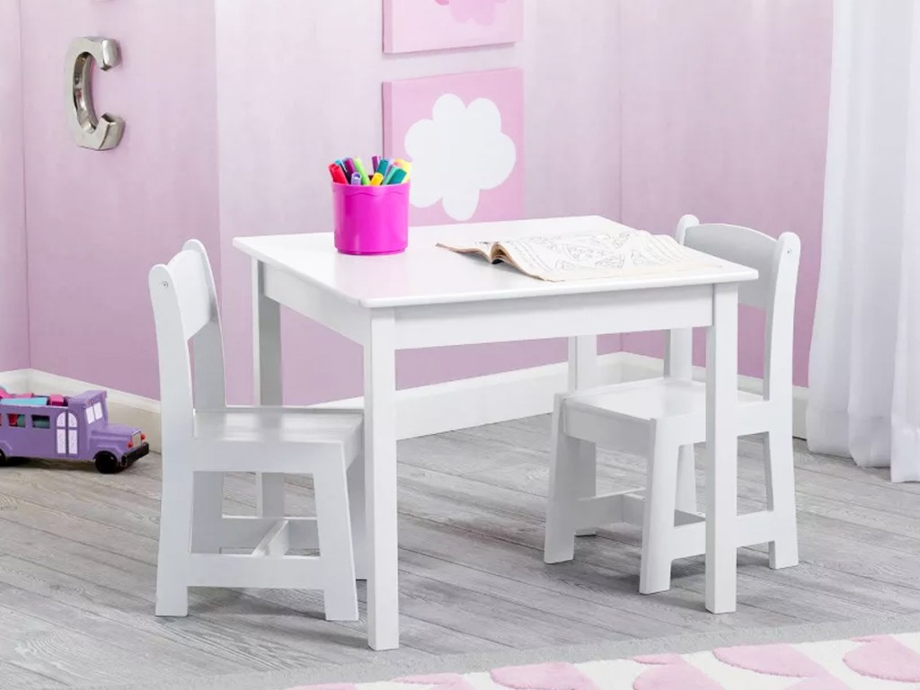 white kids table and chairs set in playroom