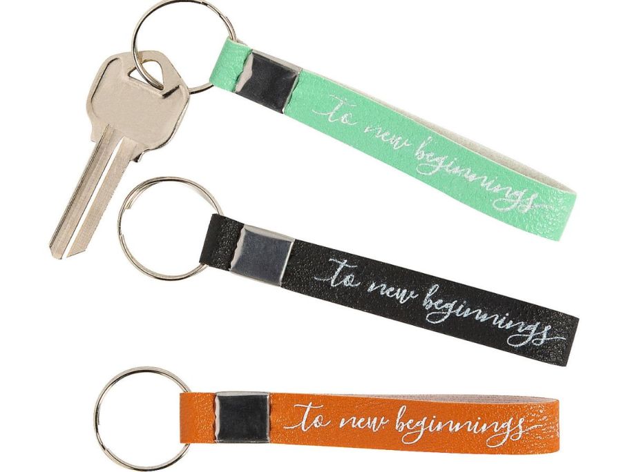 3 Graduation Faux Leather Keychains that say "To New Beginnings" 