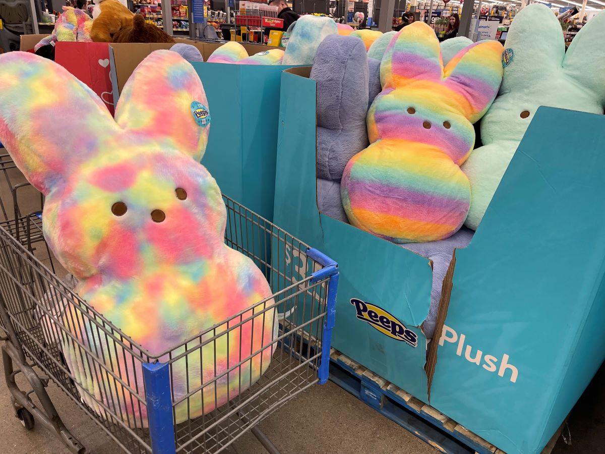 Jumbo Peeps plush in a Walmart cart and next to the display box