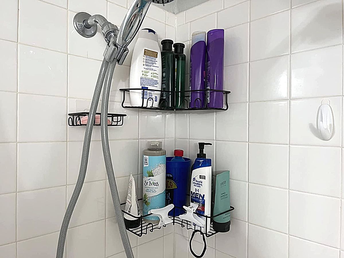 3 shower caddy holders with two of them holding product and one holding a bar of soap 