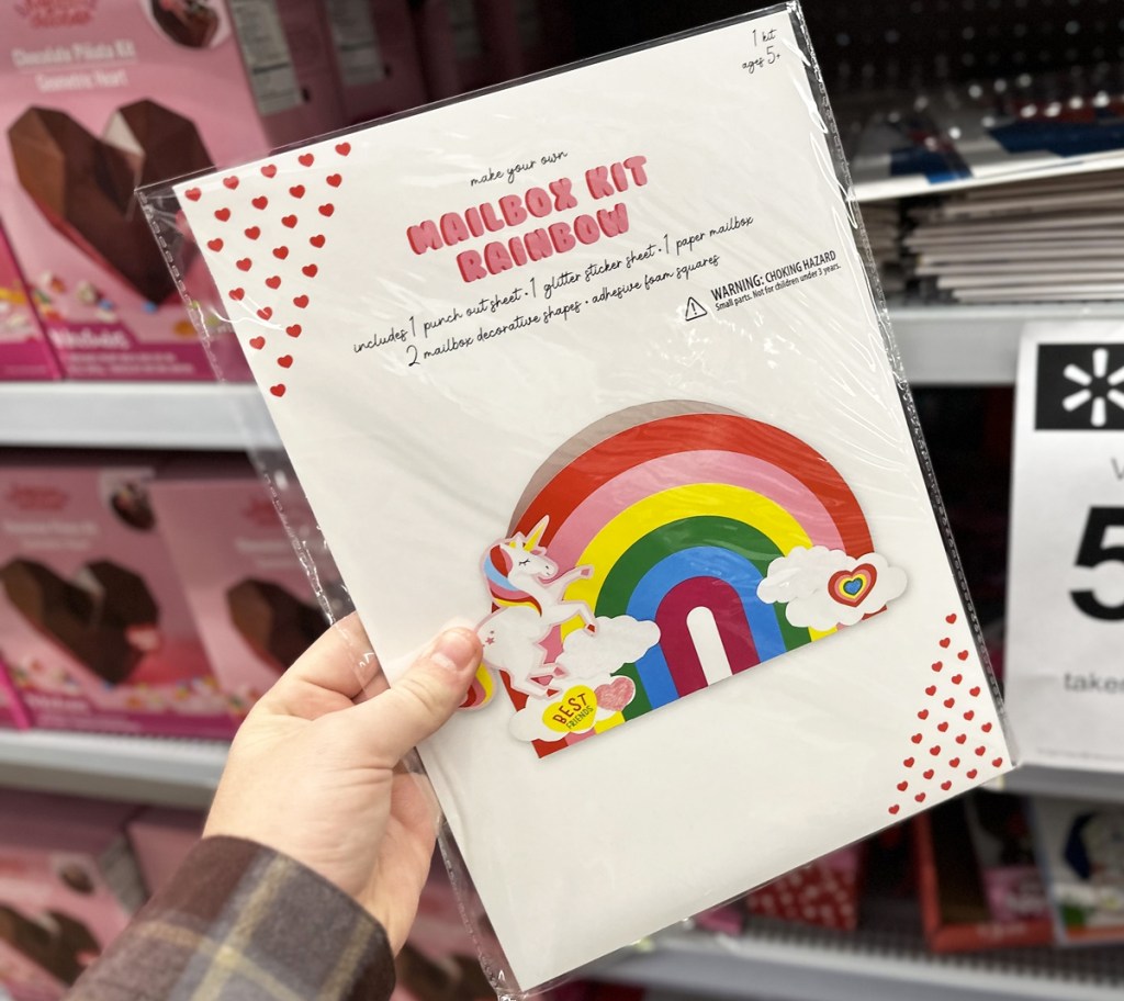 hand holding rainbow unicorn mailbox kit