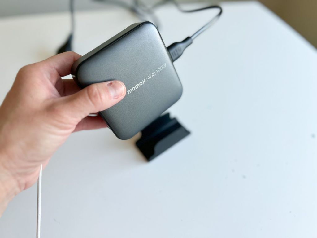 hand holding Momax USB C Charging Station