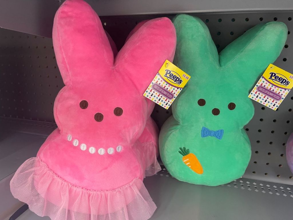 Pink Peep bunny plush with a tutu and necklace next to a green Peep bunny plush with a bowtie