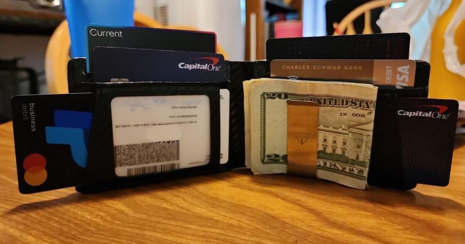 A Slim RFID Blocking Leather Wallet open on a table