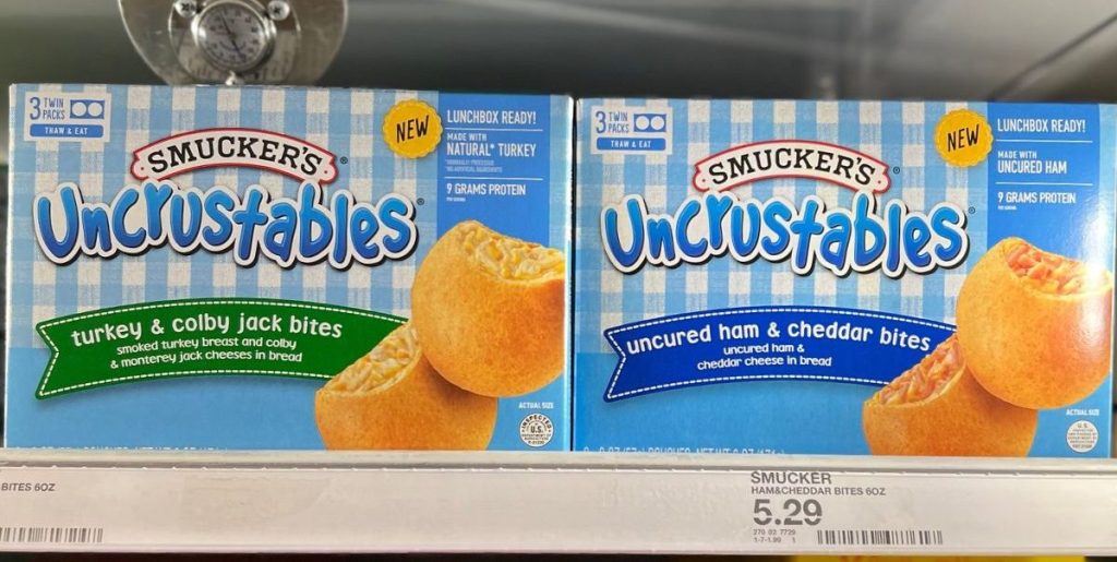 shelf in the freezer section at Target with boxes of Smucker's Uncrustables Bites on it