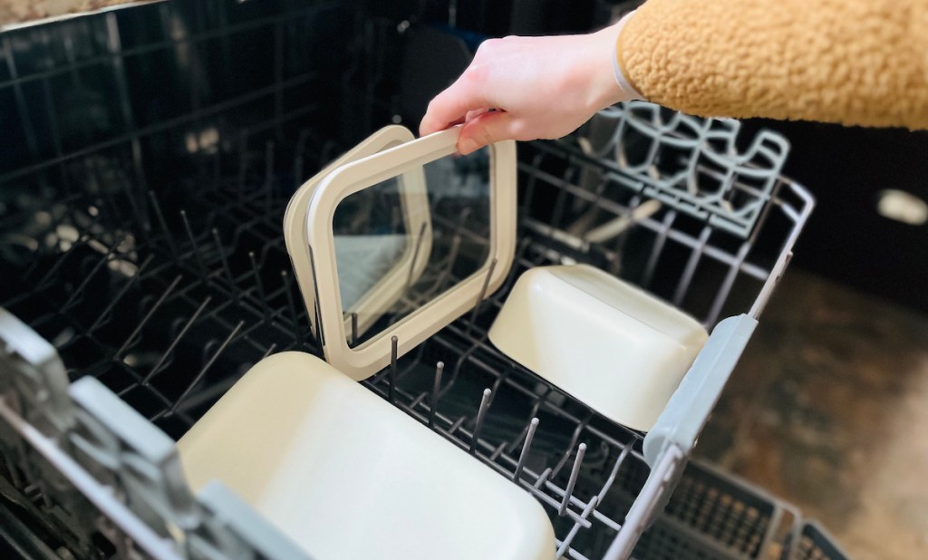 hand taking out lid from caraway food storage container