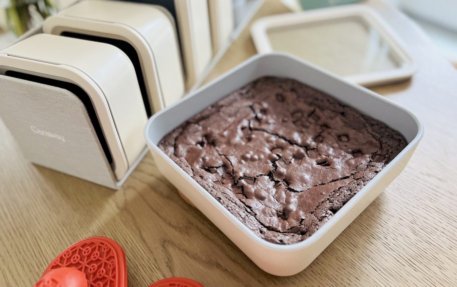 close up of brownies in baking dish sitting on wood table