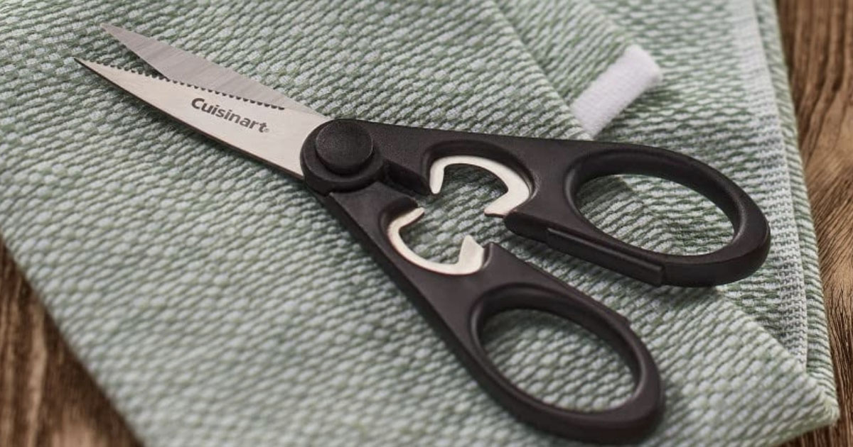 cuisinart scissors laying on green dishrag