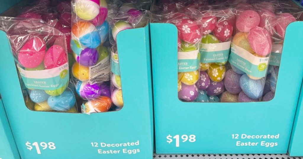 assorted decorated easter eggs in boxes on shelf