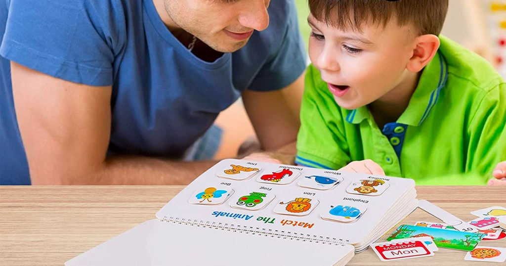 dad and child reading montessori busy book