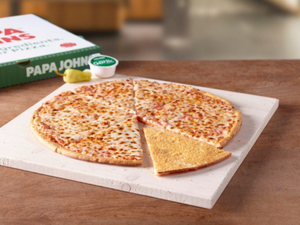 cut cheese pizza with one slice flipped over