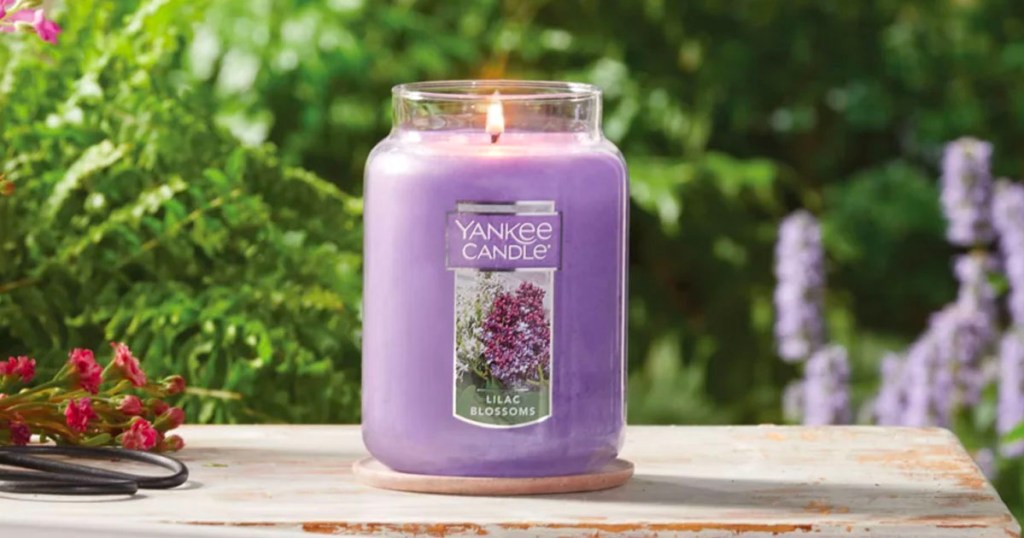 lilac flowers yankee candle on table