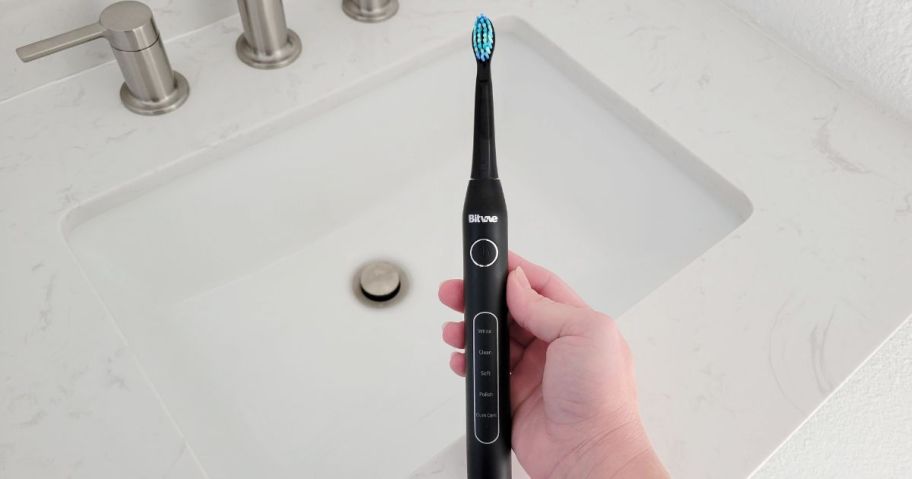 bitvae electric toothbrush in black in bathroom