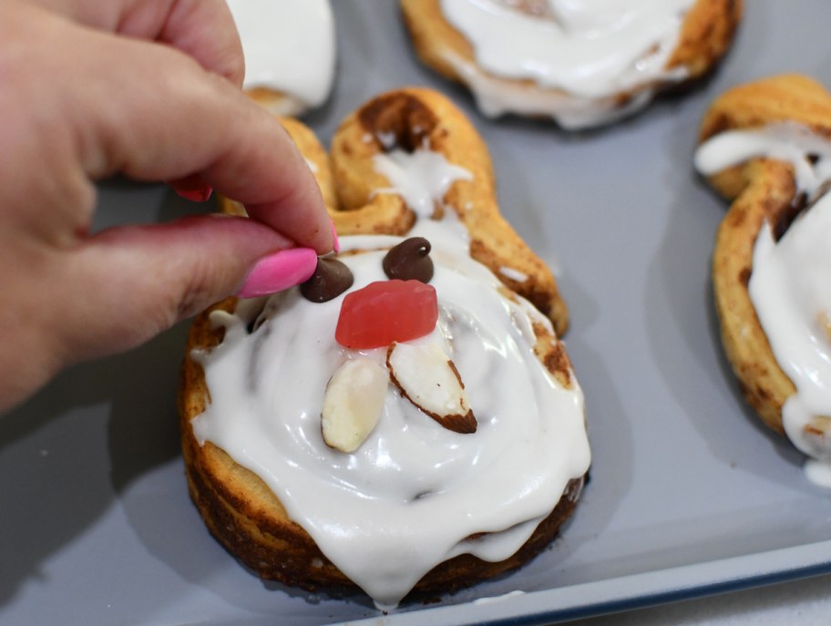 Decorating a cinnamon roll bunny for Easter brunch