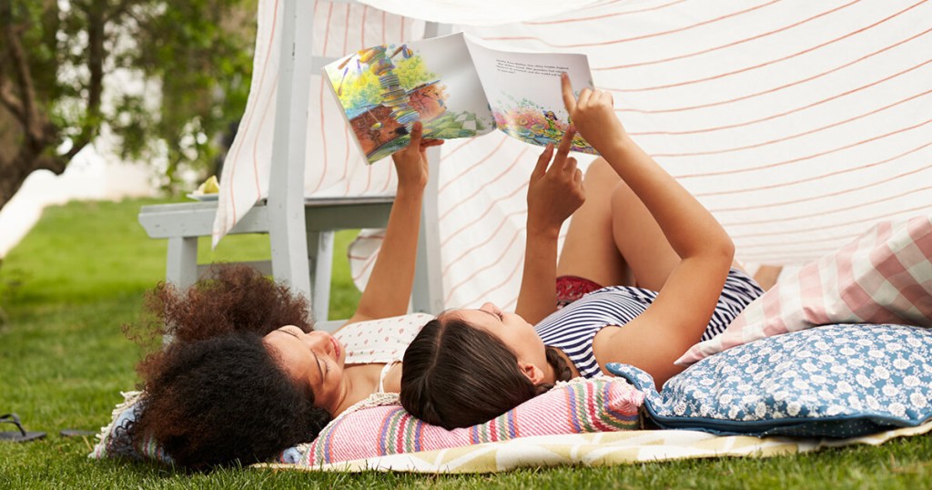 Mom and daughter reading Dolly Parton Imagination Library Books