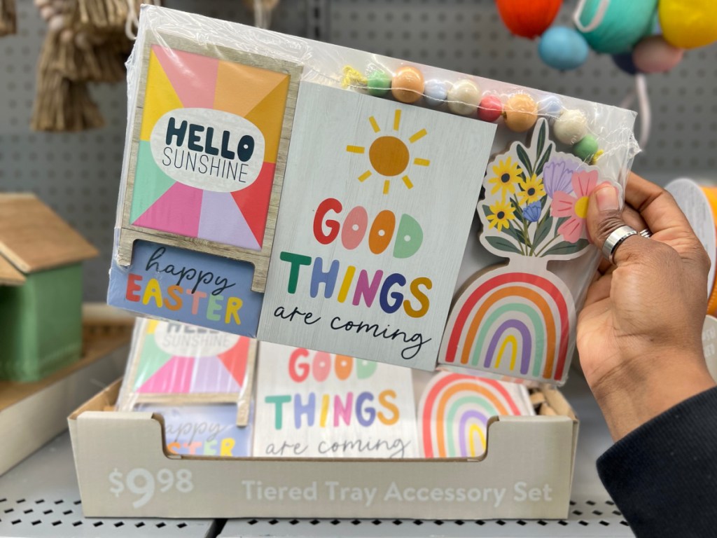 Easter Tiered Tray Accessory Set package in woman's hand at Walmart