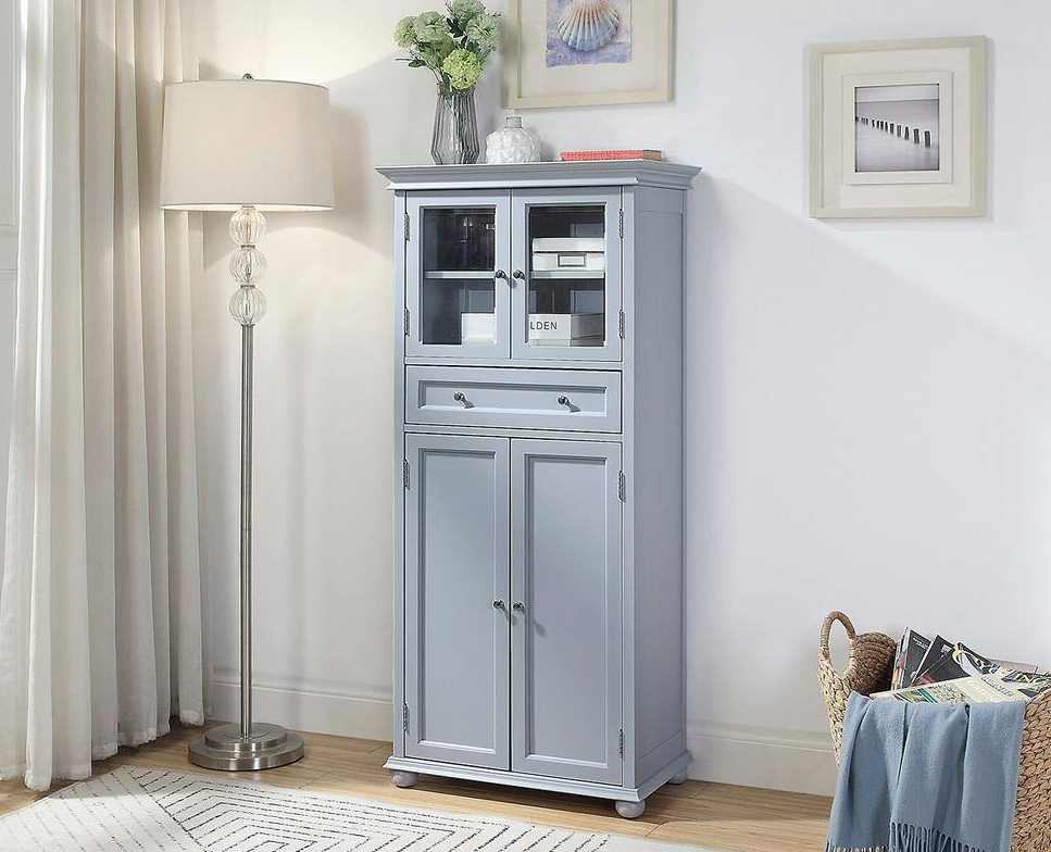 Grey cabinet with storage baskets in it