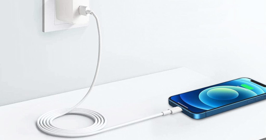 iphone plugged into white charging cable