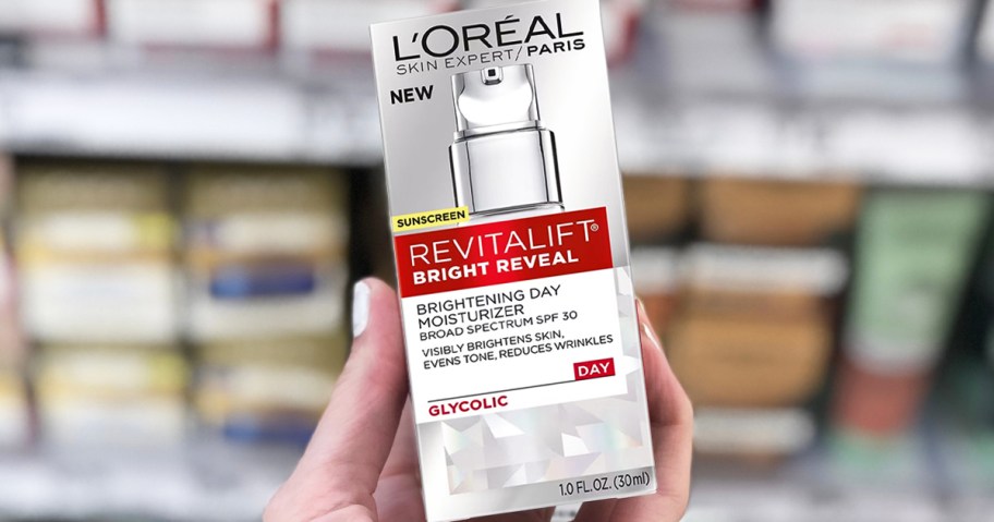 hand holding box for L'Oreal Revitalift Moisturizer in store