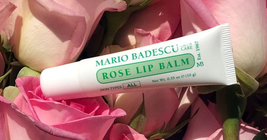 Mario Badescu Lip Balm sitting on roses