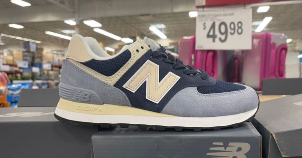 light blue, dark blue and light yellow New Balance Sneakers on display in store