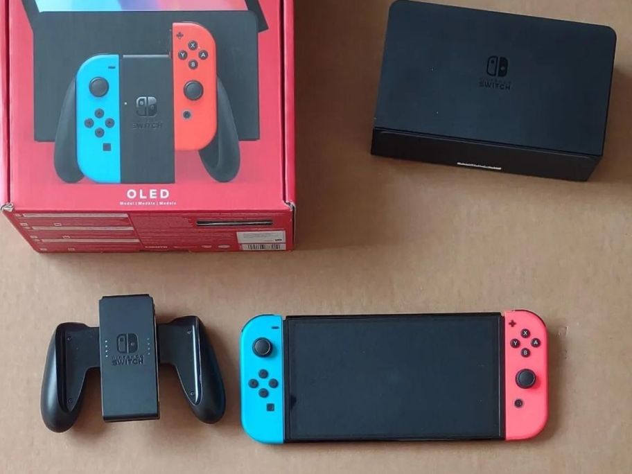 A Nintendo Switch – OLED Model w/ Neon Red & Neon Blue Joy-Con with box