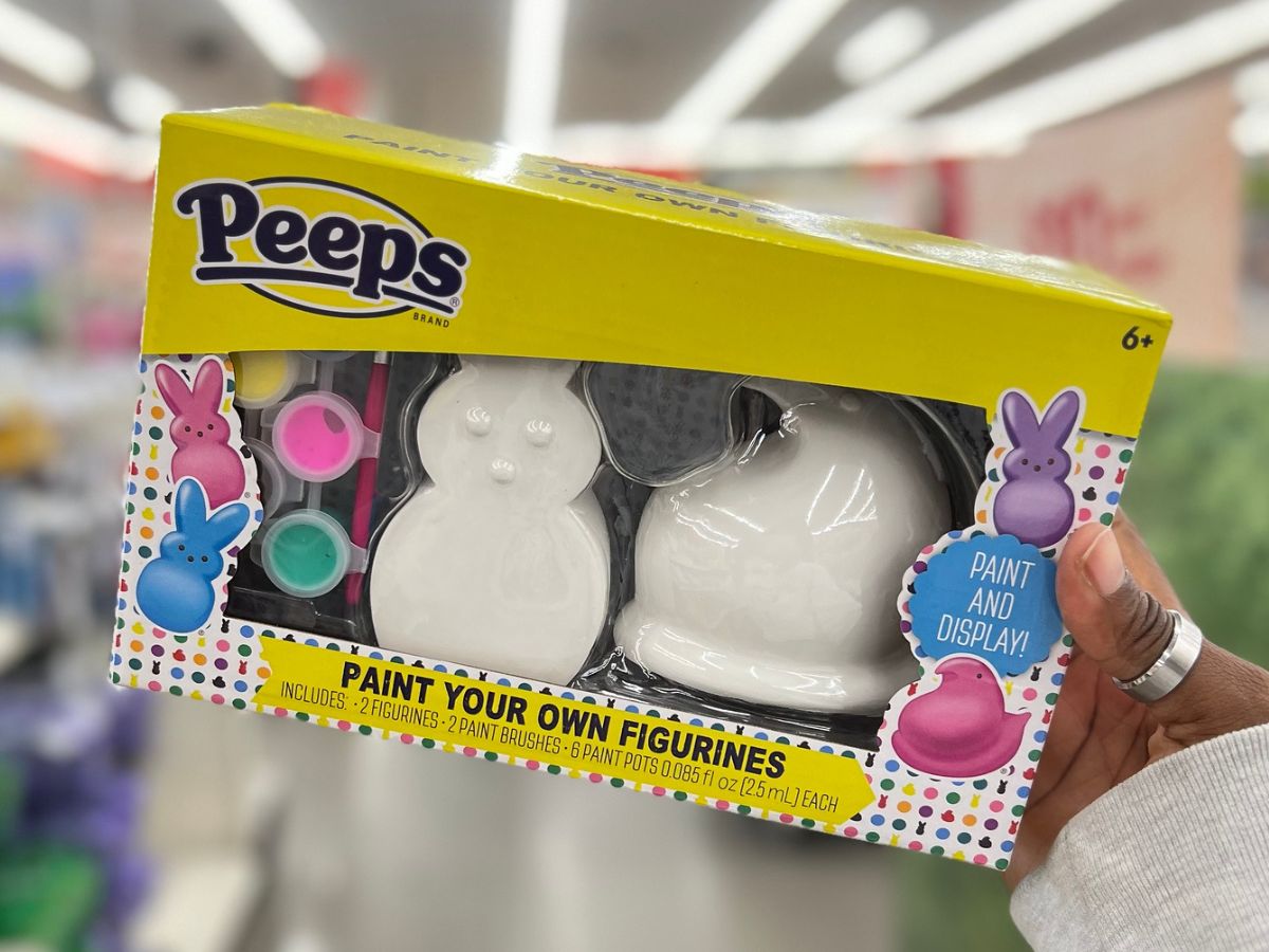 hand holding up peeps paint figures