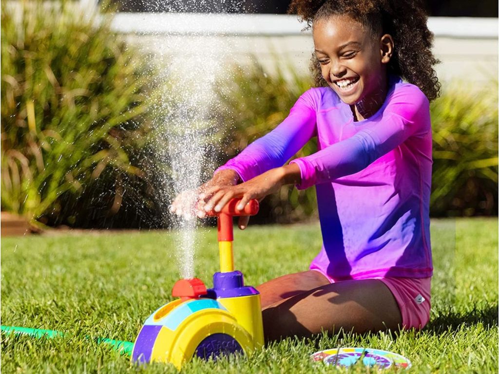 Little girl playing with Hasbro Pie Face Splash Game