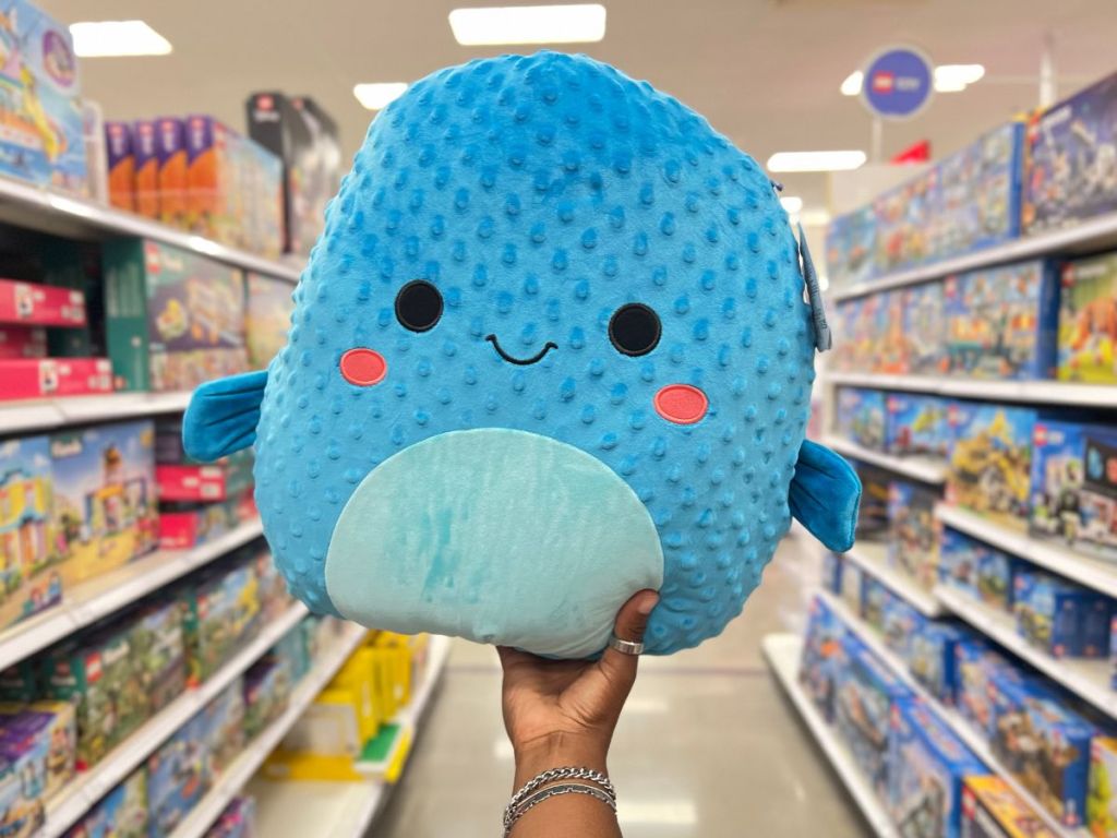 person holding Squishmallows 16" Refalo the Blue Pufferfish Plush Toy