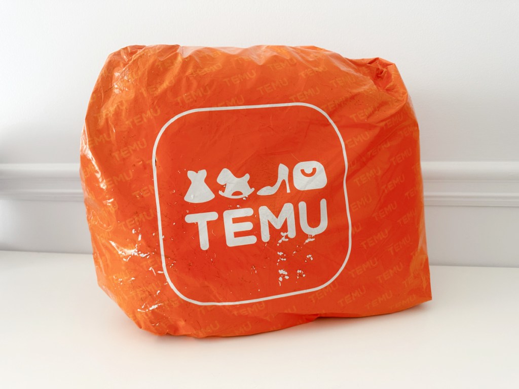 An orange Temu delivery bag