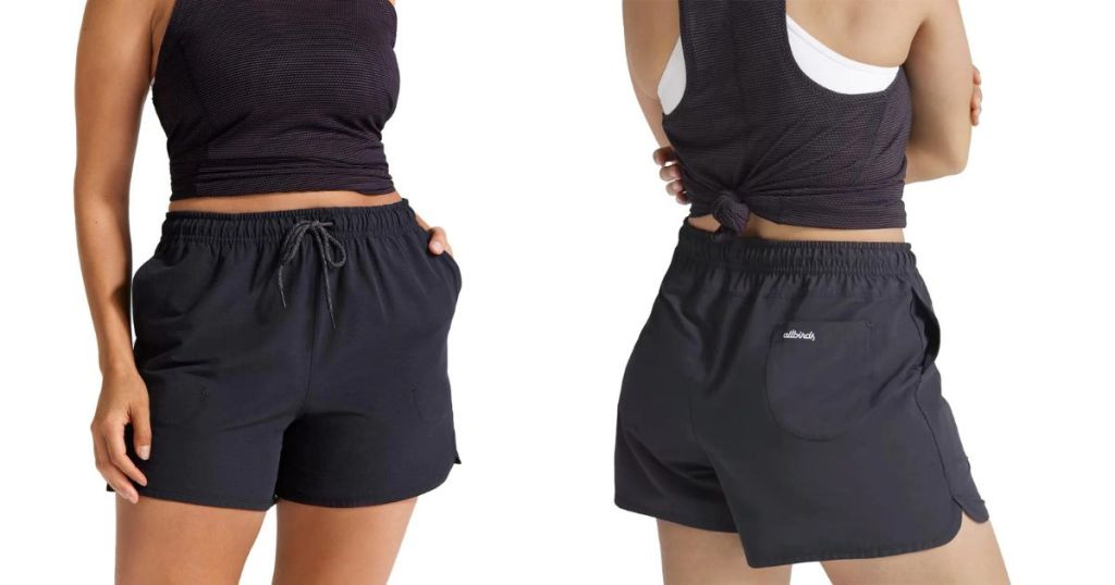 front and back view of woman wearing black tank and black shorts
