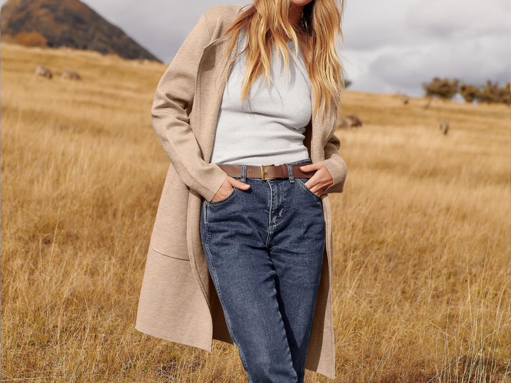 woman dressed for fall in field