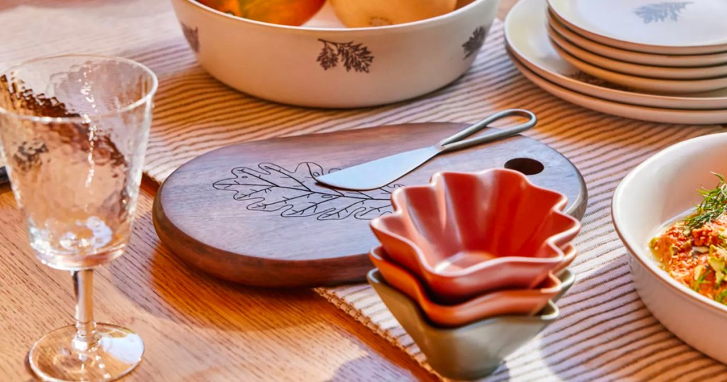 wooden serving tray with leaf on table