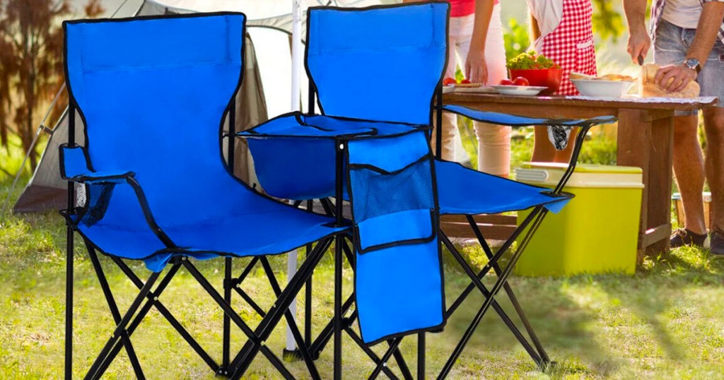 blue portable folding chair on grass at picnic