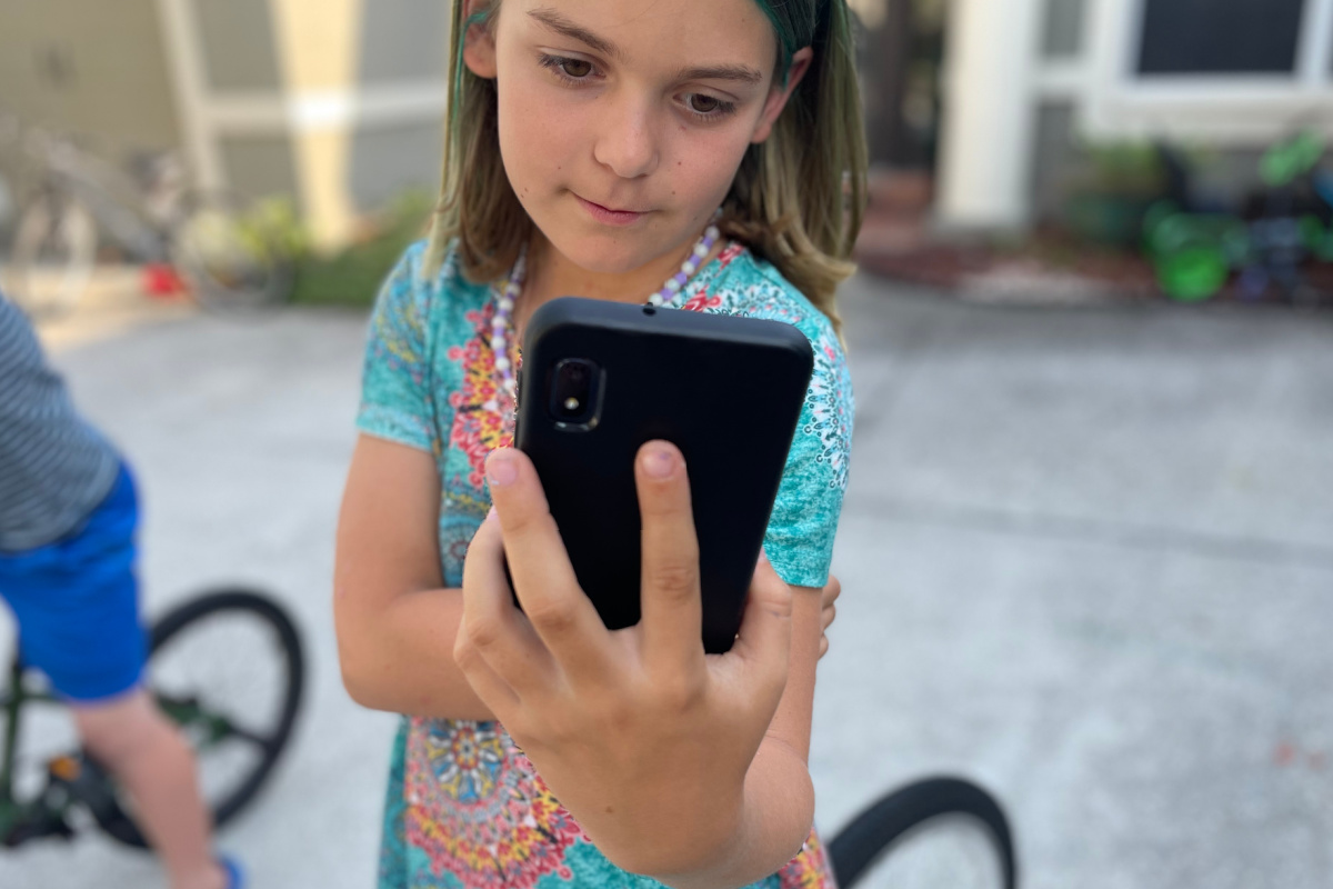 girl holding phone