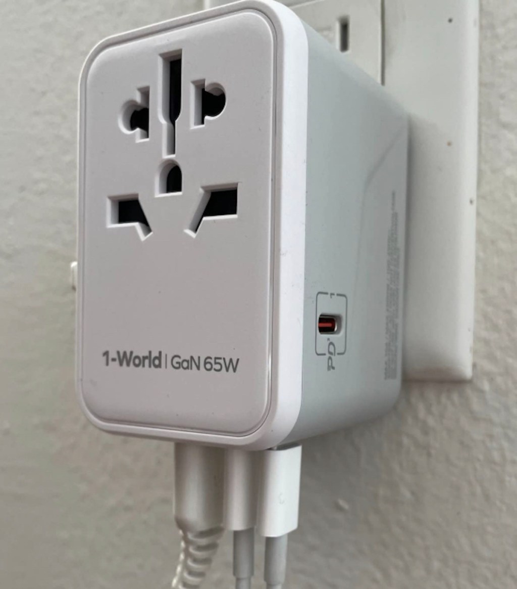 universal travel charger plugged into wall