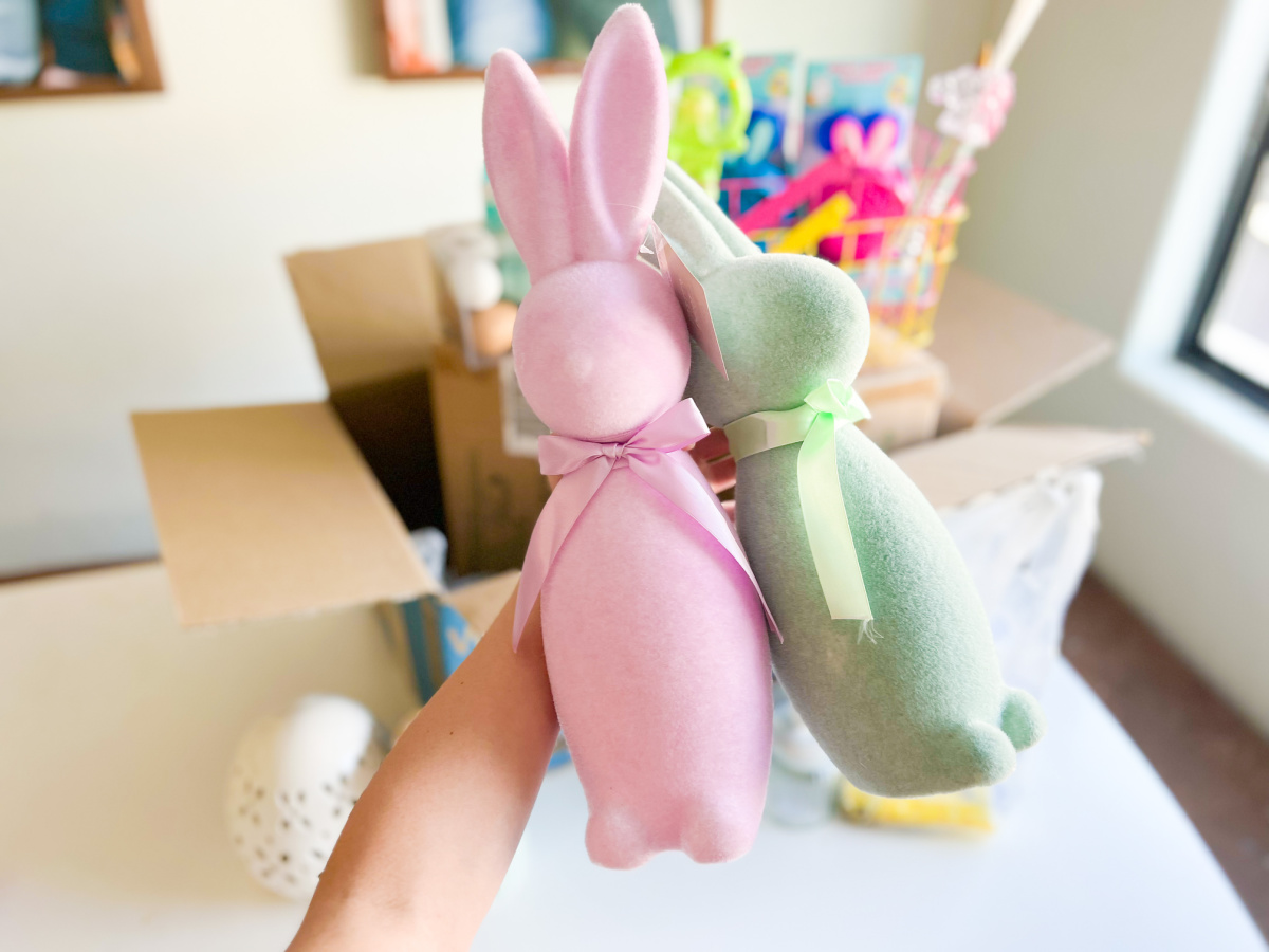 pink and green flocked bunnies in front of walmart box
