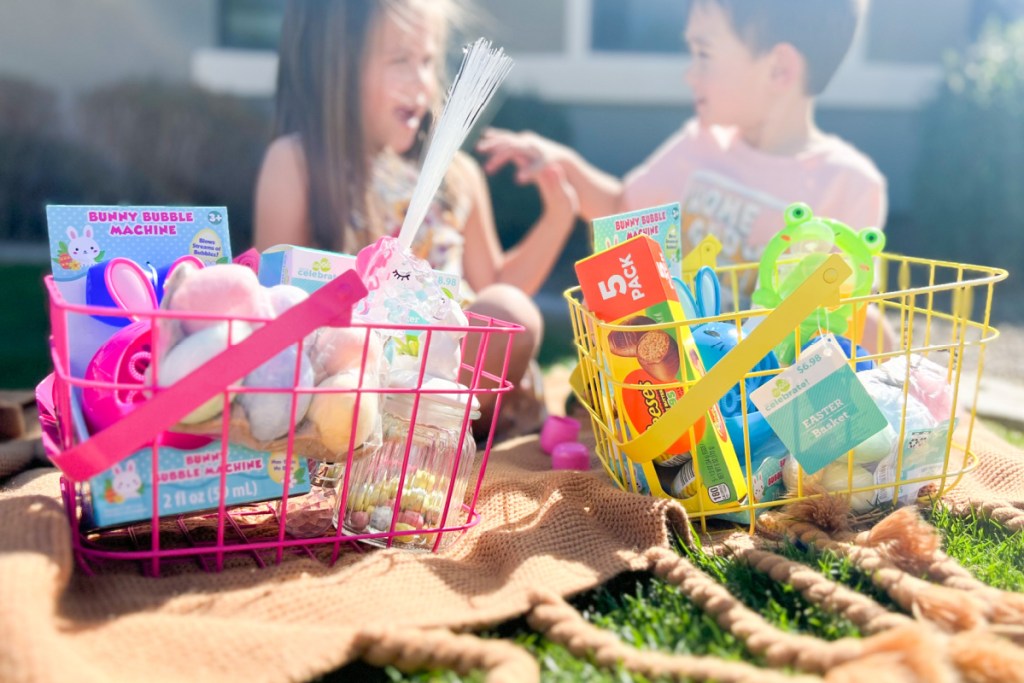 2 kids sitting next to easter baskets