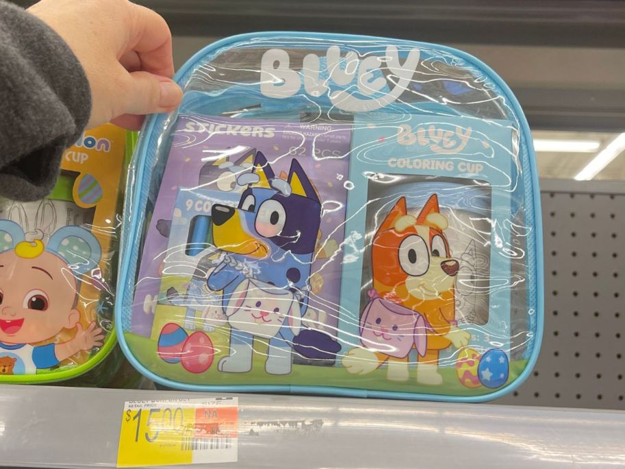 hand reaching for a Bluey Backpack Easter Gift Set on shelf