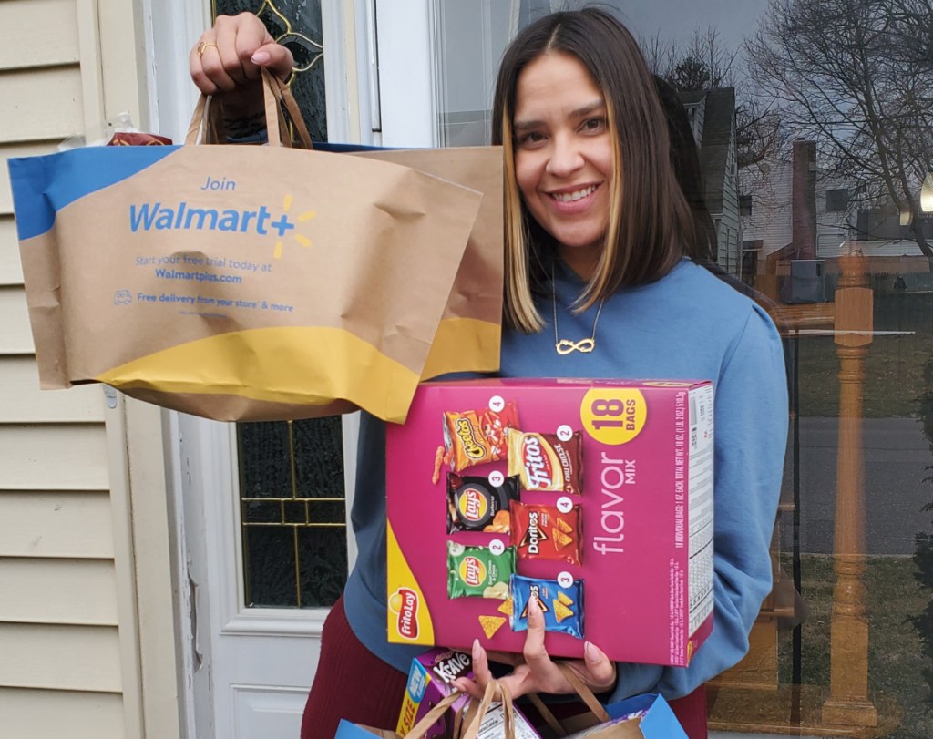 woman carrying her walmart plus delivery