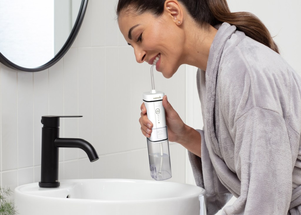 woman using the waterpik