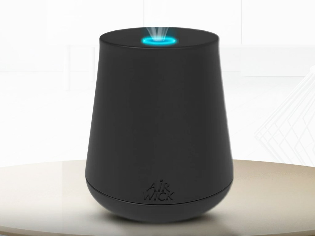 black air wick mist diffuser on table