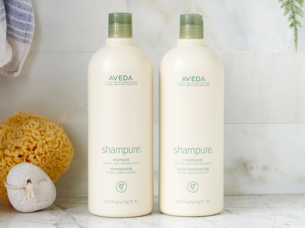 aveda shampoo & conditioner liter bottles in shower