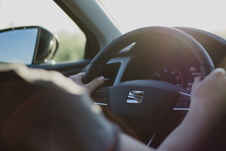 Person holding their steering wheel at 10 and 2