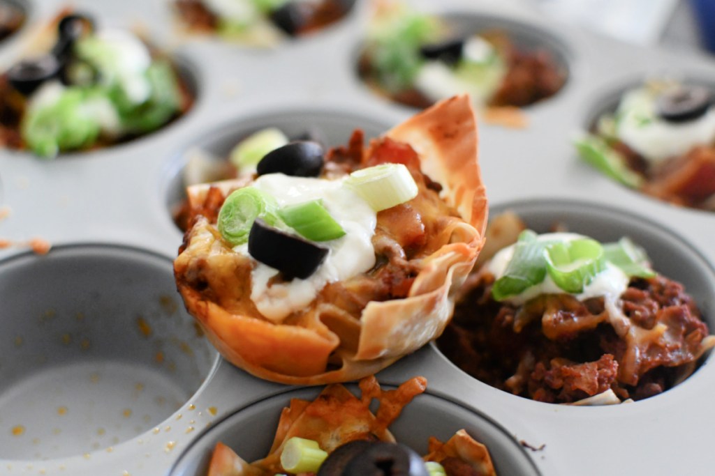 muffin pan with wanton taco cups after baking 
