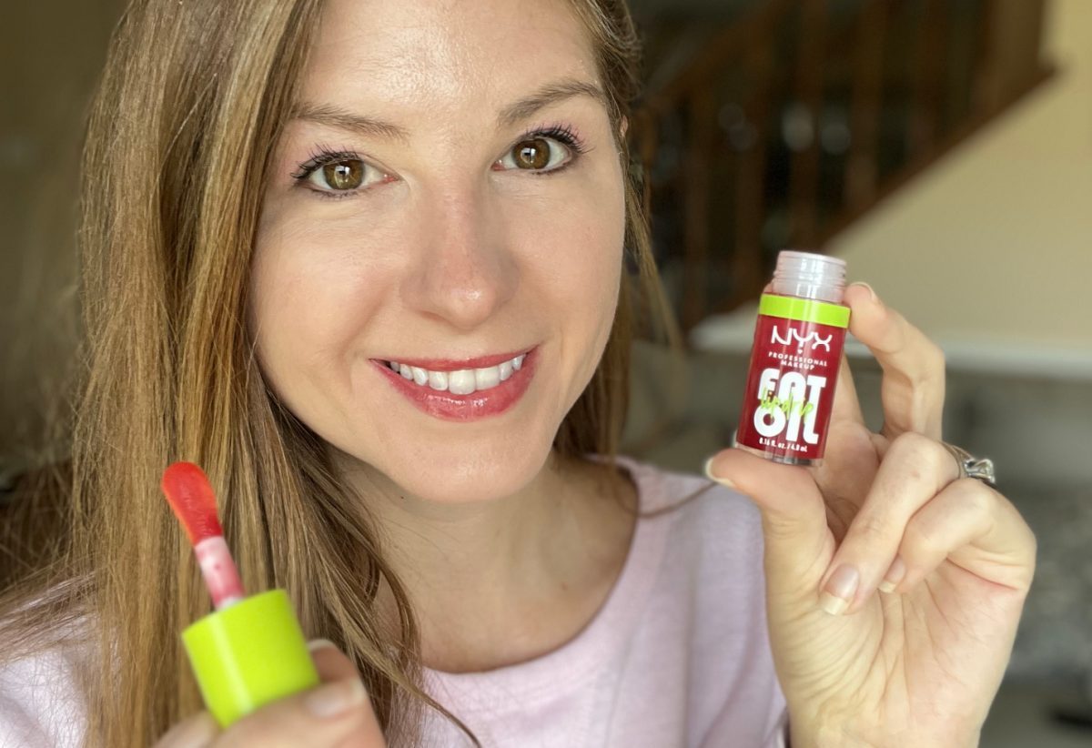 woman modeling nyx fat oil lip drip in the shade newsfeed