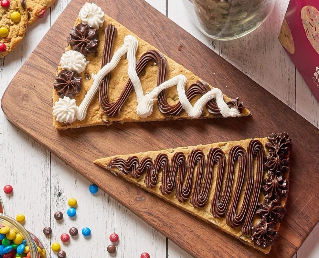 two Great American Cookies Slices on a cutting board