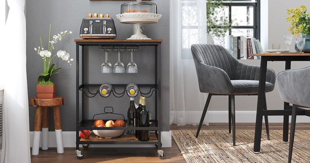 VASAGLE Bar Cart, Serving Cart with Wheels, Glass Stemware Rack and Wine Bottle Holders shown in living room / dining room