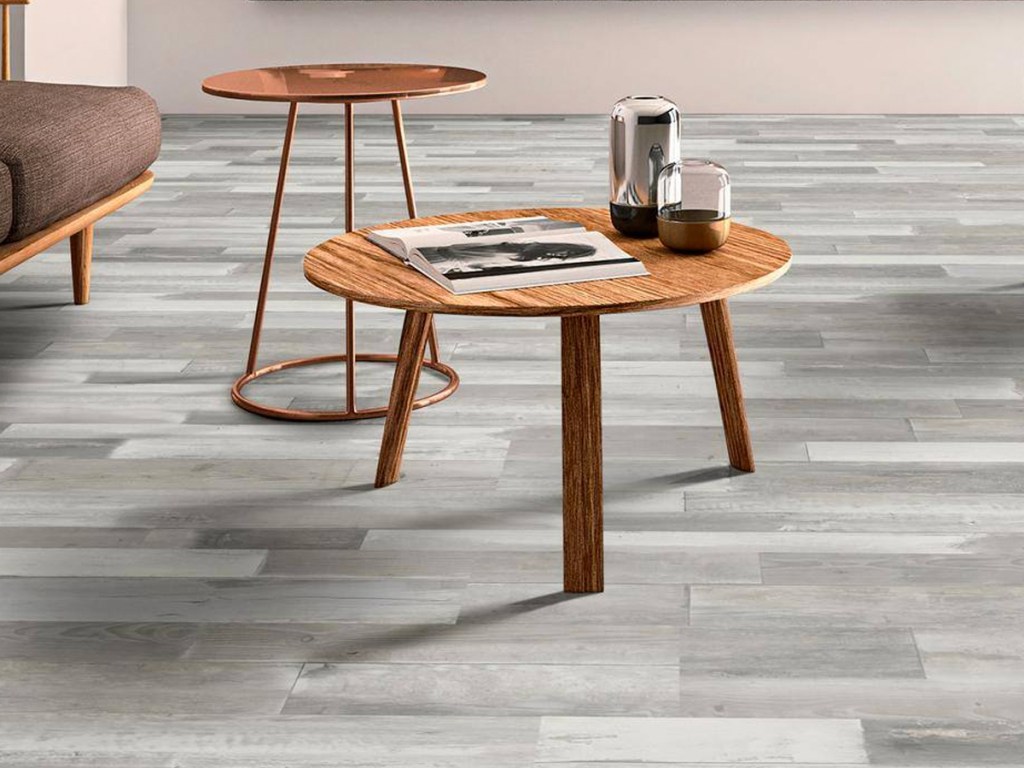 round coffee tables on top of a grey vinyl flooring